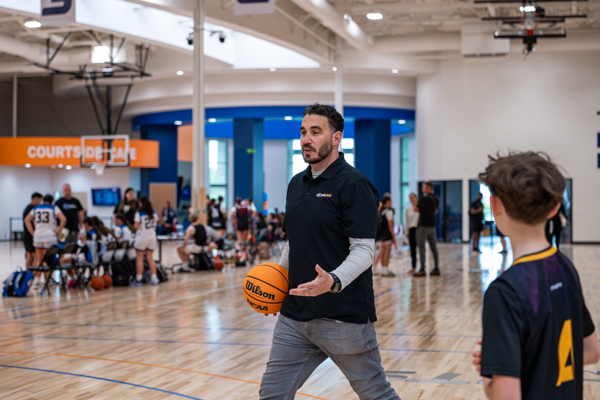 A Swysh Den coach working the sideline during a Club Team game